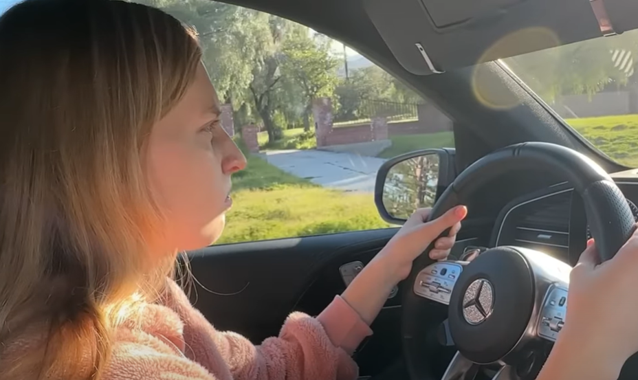 young girl driving a car for the first time